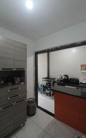 Casa de condomínio à venda com 96m², 2 quartos e sem vagaCozinha e Área de Serviço