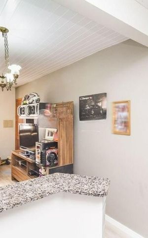 Casa à venda com 54m², 2 quartos e 2 vagas Casa à venda com 54m², 2 quartos e 2 vagasCozinha