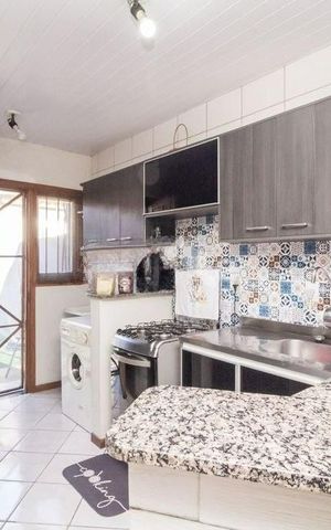 Casa à venda com 54m², 2 quartos e 2 vagas Casa à venda com 54m², 2 quartos e 2 vagasCozinha
