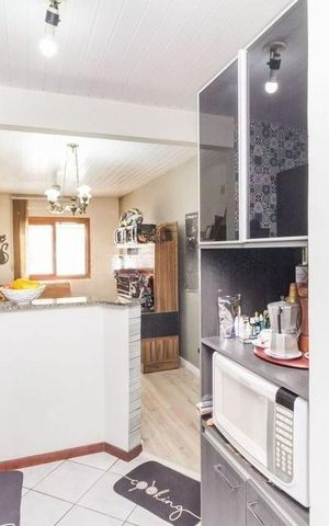 Casa à venda com 54m², 2 quartos e 2 vagas Casa à venda com 54m², 2 quartos e 2 vagasCozinha