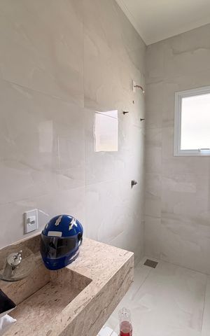 Casa de condomínio à venda com 450m², 4 quartos e 4 vagasBanheiro da Suíte 3