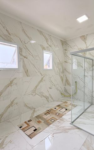 Casa de condomínio à venda com 450m², 4 quartos e 4 vagasBanheiro da Suíte 1