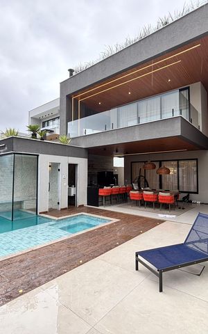 Casa de condomínio à venda com 433m², 4 quartos e 2 vagas Casa de condomínio à venda com 433m², 4 quartos e 2 vagasFachada