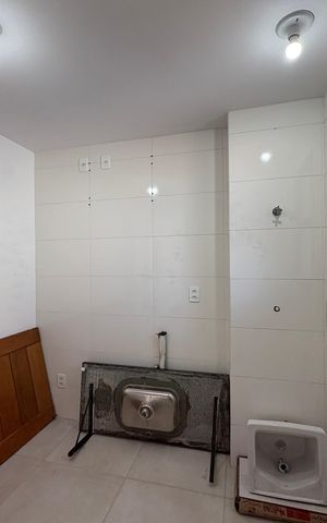 Apartamento à venda com 49m², 2 quartos e 1 vaga Apartamento à venda com 49m², 2 quartos e 1 vagaCozinha e Área de Serviço