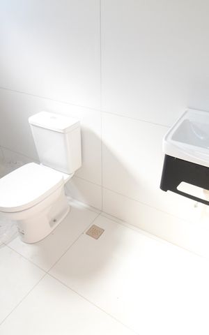 Casa de condomínio para alugar com 250m², 3 quartos e 4 vagasBanheiro da Suíte 2