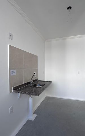 Apartamento à venda com 48m², 2 quartos e 1 vaga Apartamento à venda com 48m², 2 quartos e 1 vagaCozinha e Área de Serviço
