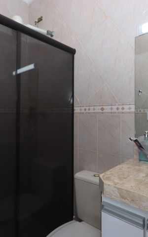 Casa de condomínio à venda com 126m², 3 quartos e 2 vagasBanheiro da Suíte