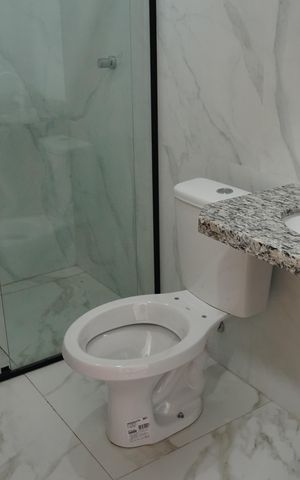 Casa à venda com 105m², 3 quartos e 2 vagasBanheiro da Suíte 1