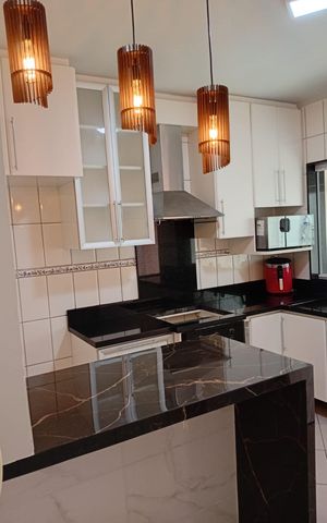 Casa à venda com 100m², 2 quartos e 2 vagas Casa à venda com 100m², 2 quartos e 2 vagasCozinha