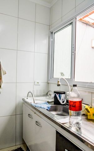 Casa à venda com 89m², 2 quartos e 2 vagas Casa à venda com 89m², 2 quartos e 2 vagasCozinha