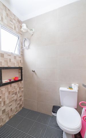 Casa à venda com 115m², 2 quartos e 3 vagasBanheiro da Suíte 1