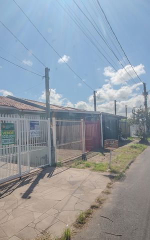 Casa à venda com 102m², 3 quartos e 2 vagas Casa à venda com 102m², 3 quartos e 2 vagasFachada/Placa