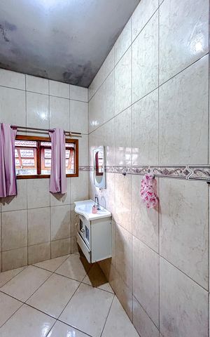 Casa à venda com 133m², 3 quartos e 4 vagasBanheiro da Suíte 2