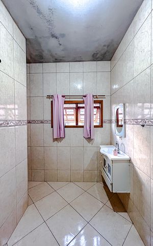Casa à venda com 133m², 3 quartos e 4 vagasBanheiro da Suíte 2