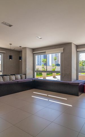 Apartamento à venda com 65m², 2 quartos e 1 vaga Apartamento à venda com 65m², 2 quartos e 1 vagaSala de estar com móveis modernos e iluminação natural, vista para a cidade.