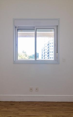 Apartamento à venda com 65m², 2 quartos e 1 vaga Apartamento à venda com 65m², 2 quartos e 1 vagaJanela com vista para o edifício ao lado, com árvores e céu claro.