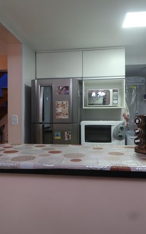 Casa de condomínio à venda com 134m², 3 quartos e 2 vagasCozinha - Armários