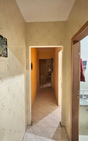 Casa à venda com 100m², 2 quartos e 2 vagasCorredor