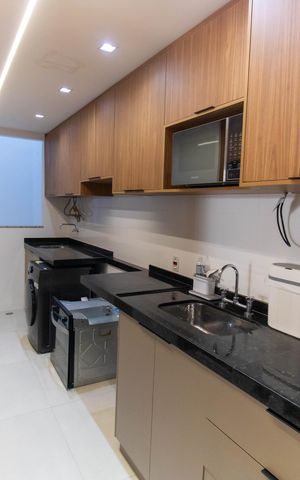 Apartamento à venda com 99m², 2 quartos e 2 vagas Apartamento à venda com 99m², 2 quartos e 2 vagasCozinha e Área de Serviço