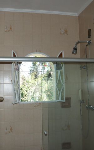 Casa de condomínio para alugar com 591m², 7 quartos e 4 vagasBanheiro da Suíte 4