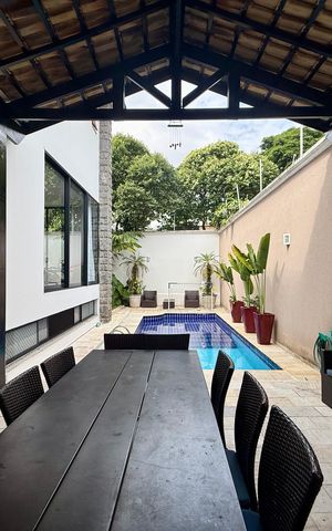 Casa de condomínio à venda com 397m², 4 quartos e 4 vagas Casa de condomínio à venda com 397m², 4 quartos e 4 vagasChurrasqueira