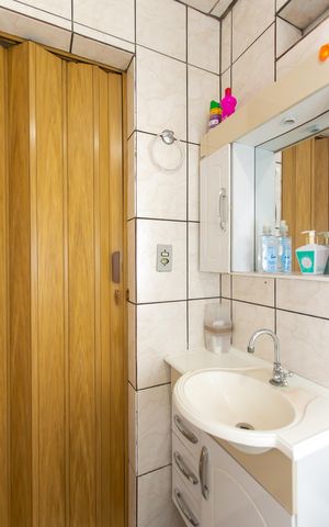 Casa à venda com 64m², 2 quartos e 1 vaga Casa à venda com 64m², 2 quartos e 1 vagaBanheiro