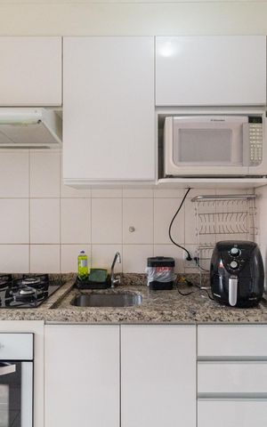 Apartamento à venda com 57m², 2 quartos e 1 vaga Apartamento à venda com 57m², 2 quartos e 1 vagaCozinha e área de serviço