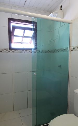 Casa de condomínio à venda com 60m², 2 quartos e 2 vagasBanheiro Social