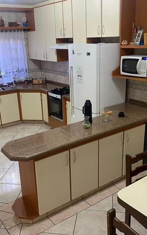 Casa à venda com 164m², 3 quartos e 2 vagas Casa à venda com 164m², 3 quartos e 2 vagasCozinha