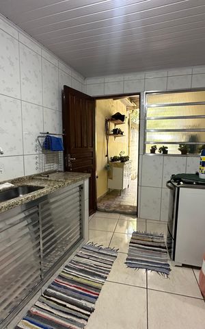 Casa à venda com 121m², 2 quartos e 2 vagas Casa à venda com 121m², 2 quartos e 2 vagasCozinha