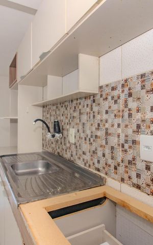 Apartamento à venda com 48m², 2 quartos e 1 vaga Apartamento à venda com 48m², 2 quartos e 1 vagaCozinha e Área de Serviço