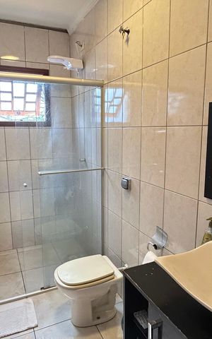 Casa à venda com 150m², 3 quartos e 3 vagas Casa à venda com 150m², 3 quartos e 3 vagasBanheiro 1