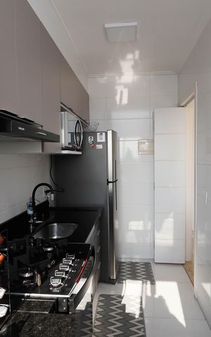 Apartamento à venda com 54m², 2 quartos e 1 vaga Apartamento à venda com 54m², 2 quartos e 1 vagaCozinha e Área de Serviço