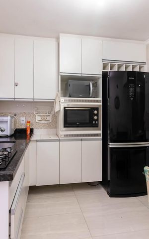 Casa de condomínio para alugar com 100m², 3 quartos e 2 vagas Casa de condomínio para alugar com 100m², 3 quartos e 2 vagasCozinha e Sala de Jantar
