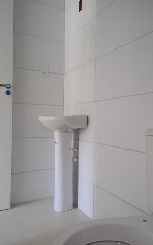 Casa à venda com 57m², 3 quartos e 2 vagasBanheiro da Suíte