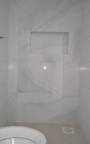 Casa à venda com 57m², 3 quartos e 2 vagasBanheiro da Suíte