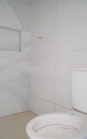 Casa à venda com 58m², 3 quartos e 2 vagasBanheiro da Suíte