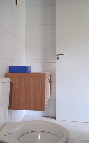 Casa à venda com 58m², 3 quartos e 2 vagasBanheiro da Suíte