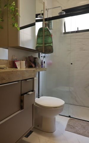 Casa de condomínio para alugar com 160m², 3 quartos e 4 vagasBanheiro da Suíte 1