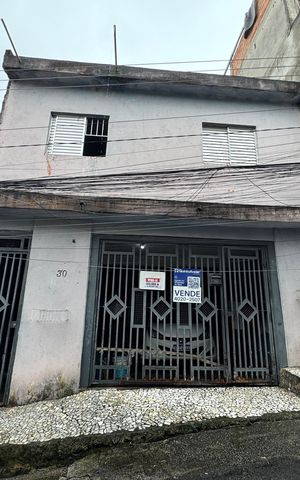 Casa à venda com 96m², 4 quartos e 2 vagas Casa à venda com 96m², 4 quartos e 2 vagasFachada com placa