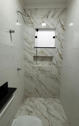 Casa à venda com 74m², 2 quartos e 2 vagas Casa à venda com 74m², 2 quartos e 2 vagasBanheiro da Suíte