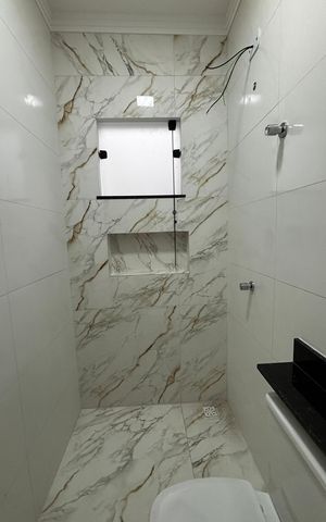 Casa à venda com 74m², 2 quartos e 2 vagas Casa à venda com 74m², 2 quartos e 2 vagasBanheiro da Suíte