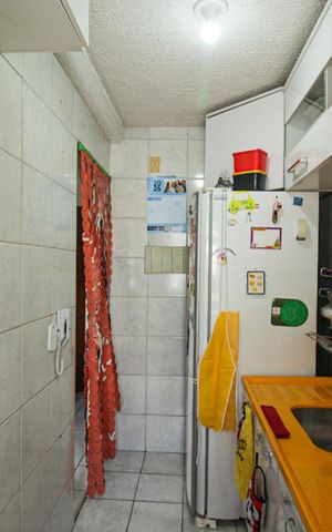 Apartamento à venda com 48m², 3 quartos e 1 vaga Apartamento à venda com 48m², 3 quartos e 1 vagaCozinha e Área de Serviço