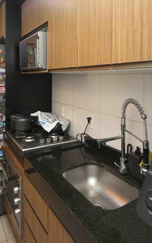 Apartamento à venda com 48m², 2 quartos e 1 vaga Apartamento à venda com 48m², 2 quartos e 1 vagaCozinha e Área de Serviço