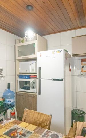 Casa à venda com 86m², 3 quartos e 2 vagas Casa à venda com 86m², 3 quartos e 2 vagasCozinha