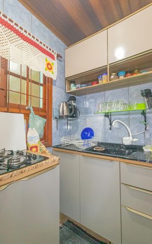Casa à venda com 86m², 3 quartos e 2 vagas Casa à venda com 86m², 3 quartos e 2 vagasCozinha