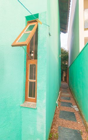 Casa à venda com 86m², 3 quartos e 2 vagas Casa à venda com 86m², 3 quartos e 2 vagasFachada Lateral