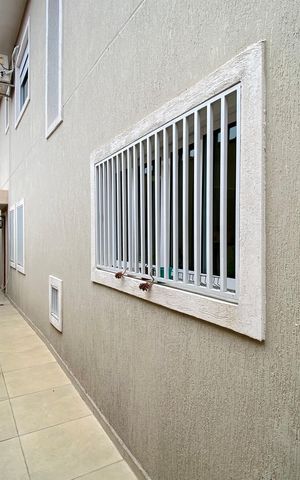 Casa à venda com 137m², 3 quartos e 3 vagas Casa à venda com 137m², 3 quartos e 3 vagasCorredor externo
