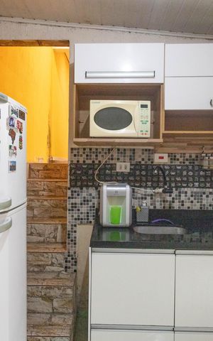 Casa à venda com 150m², 2 quartos e 2 vagas Casa à venda com 150m², 2 quartos e 2 vagasCozinha