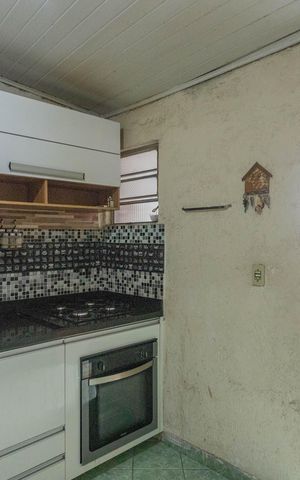 Casa à venda com 150m², 2 quartos e 2 vagas Casa à venda com 150m², 2 quartos e 2 vagasCozinha